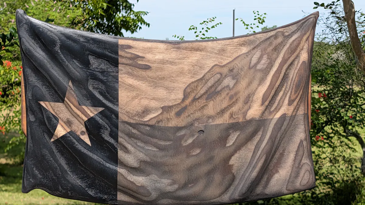 Texas Lone Star Flag -- 3D wavy wooden flag with a single star design and a natural wood knot